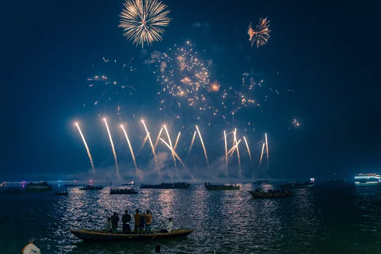 Boat Ride During Dev Deepawali in Varanasi Boat ride on the River Ganga offering views of illuminated ghats during Dev Deepawali
